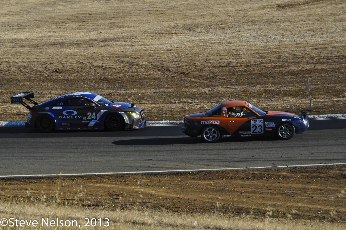 Yin and Yang. The Rotek Audi TT emerged in front when the prototypes wilted, and then never looked back. Late in the race it is putting one of 77 extra laps on the RJ Racing Miata—winner of the nearly all-Miata E3 class.